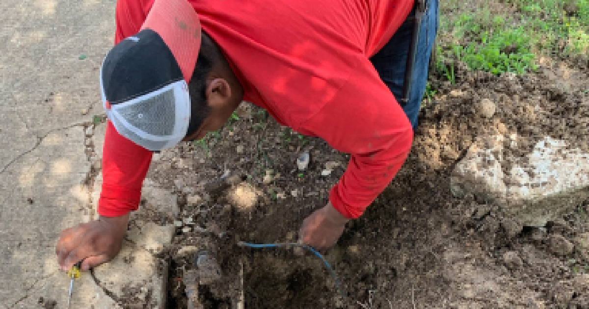 2 Men Working on Grass, Digging